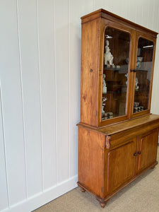 A 19th Century English Pine Bookcase with Glazed Top Doors