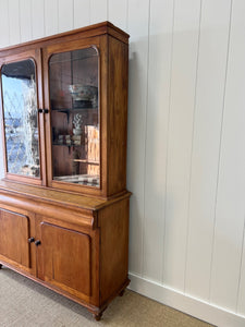 A 19th Century English Pine Bookcase with Glazed Top Doors