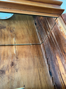 A 19th Century English Pine Bookcase with Glazed Top Doors