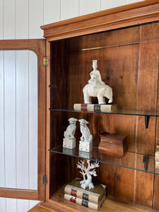 A 19th Century English Pine Bookcase with Glazed Top Doors