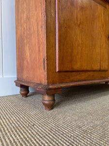 A 19th Century English Pine Bookcase with Glazed Top Doors