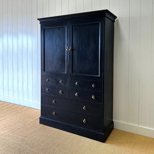 A Large 19th Century English Ebonized Linen Press Cupboard