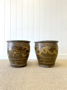 A Pair of Antique Chinese Garden Pots with Dragon Motif