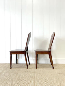 A Pair of Regency Fluted Leg Hall Chairs