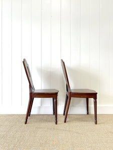 A Pair of Regency Fluted Leg Hall Chairs