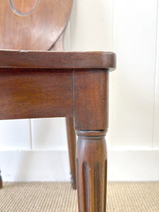 A Pair of Regency Fluted Leg Hall Chairs