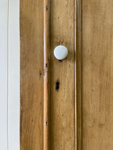 A Handsome English 19th Pine Cupboard with Porcelain Knobs