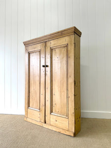 An English 19th Century Shallow Pine Cupboard