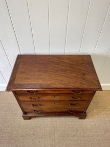 A Petite English Mahogany Bachelors Chest of Drawers Dresser with Brushing Slide  c1800