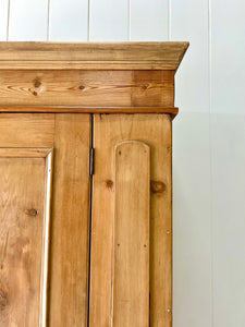 A Handsome English 19th Pine Cupboard with Dark Wooden Knobs