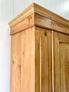 A Handsome English 19th Pine Cupboard with Dark Wooden Knobs