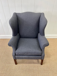 An Antique English Mahogany Wing Back Chair