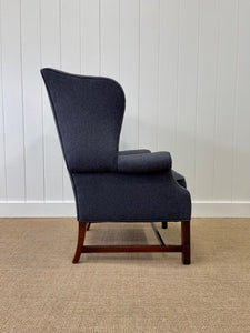 An Antique English Mahogany Wing Back Chair