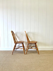 A Set of Four Ash Crinoline Stretcher Windsor Chairs