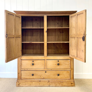 An 18th Century English Pine Linen Press Cupboard