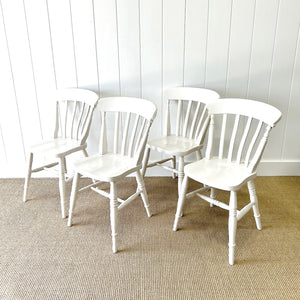 A Vintage Set of 4 White Slat Back Chairs