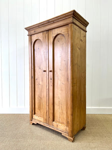 A 19th Century Pine Cupboard with Arched Doors