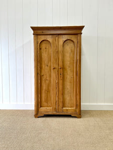 A 19th Century Pine Cupboard with Arched Doors