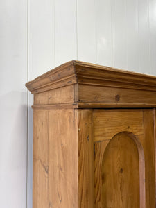 A 19th Century Pine Cupboard with Arched Doors