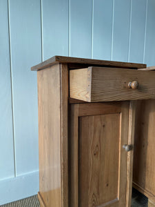 A Charming Pair of English Pine Nightstands