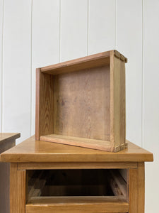 A Charming Pair of English Pine Nightstands