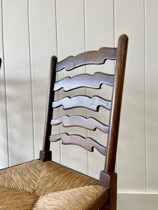 A Vintage Set of 8 English Oak Ladder Back Chairs