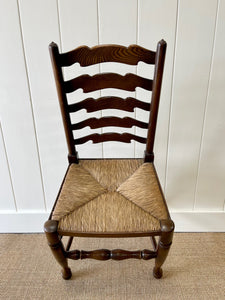 A Vintage Set of 8 English Oak Ladder Back Chairs