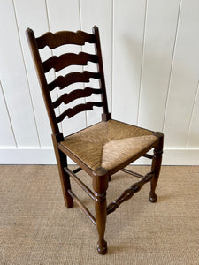 A Vintage Set of 8 English Oak Ladder Back Chairs