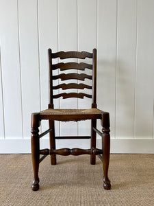 A Vintage Set of 8 English Oak Ladder Back Chairs