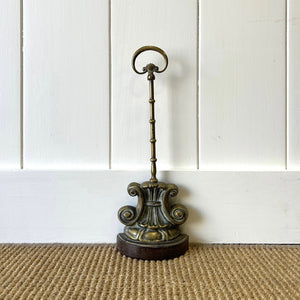 An Antique Victorian Brass Door Stop