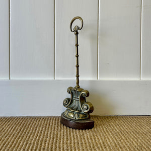 An Antique Victorian Brass Door Stop