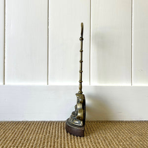 An Antique Victorian Brass Door Stop