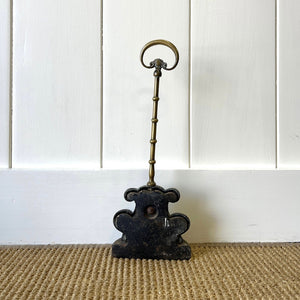 An Antique Victorian Brass Door Stop