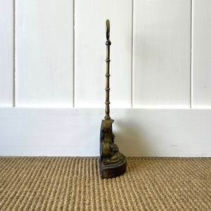 An Antique Victorian Brass Door Stop