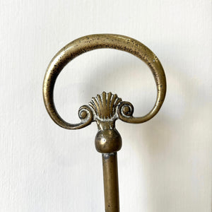 An Antique Victorian Brass Door Stop