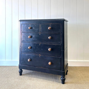 A Tall Ebonized Antique English Chest of Drawers/Dresser