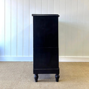 A Tall Ebonized Antique English Chest of Drawers/Dresser