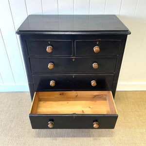 A Tall Ebonized Antique English Chest of Drawers/Dresser