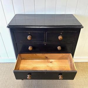 A Tall Ebonized Antique English Chest of Drawers/Dresser