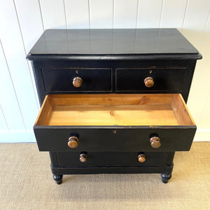 A Tall Ebonized Antique English Chest of Drawers/Dresser