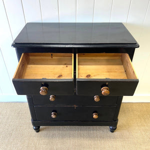 A Tall Ebonized Antique English Chest of Drawers/Dresser