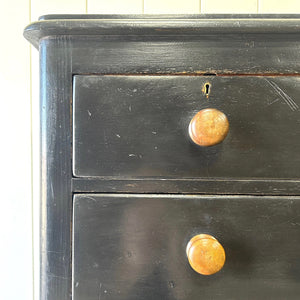 A Tall Ebonized Antique English Chest of Drawers/Dresser