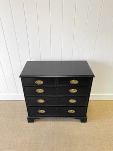 An Ebonized Antique English Chest of Drawers/Dresser