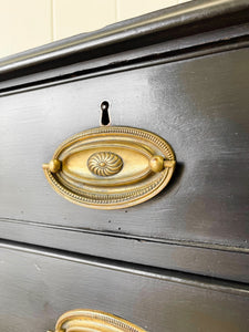 An Ebonized Antique English Chest of Drawers/Dresser