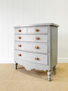 A 19th Century Bow Front English Chest of Drawers or Dresser