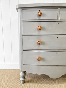 A 19th Century Bow Front English Chest of Drawers or Dresser