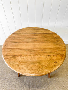 An Ercol Elm & Beech Drop Leaf Dining Table