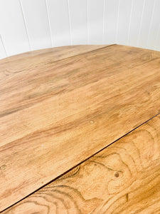 An Ercol Elm & Beech Drop Leaf Dining Table