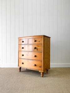 A 19th Century Bow Front English Chest of Drawers