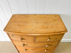 A 19th Century Bow Front English Chest of Drawers